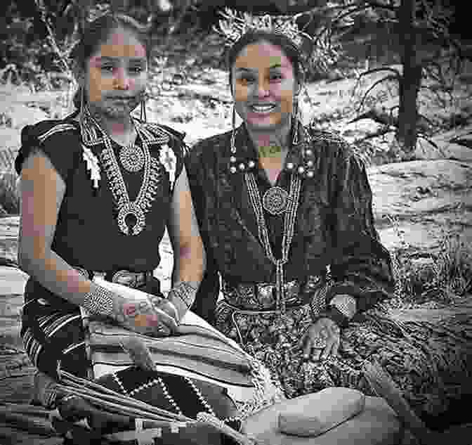 A Black And White Photograph Of Tay Bodal, A Young Navajo Woman With Long Hair And A Traditional Navajo Dress. Death At Rainy Mountain (A Tay Bodal Mystery 1)