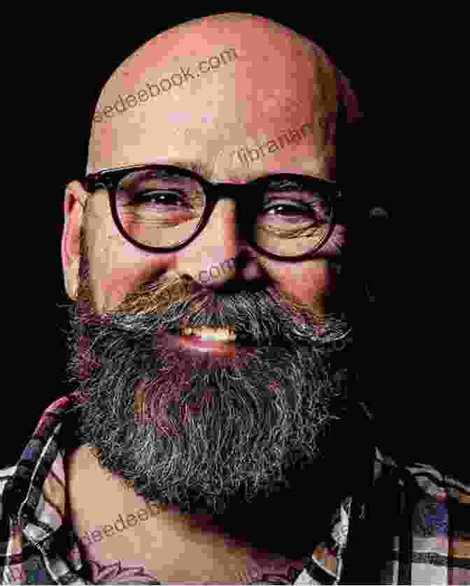 Serge Bouchard, A Man With A White Beard And Glasses, Is Sitting At A Spinning Wheel, Smiling. The Intentional Spinner Serge Bouchard